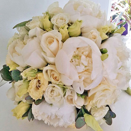 Flowers. Bridal bouquet of white peonies, roses and lisianthus.

A wedding is a special event and each bridal bouquet is