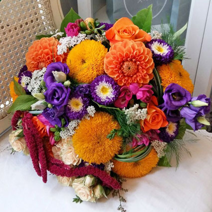 Flowers on-line. Bridal bouquet in bright colors, made of summer flowers: dahlias, asters, sunflowers.

A wedding is a