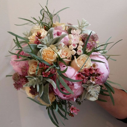 Flowers in Riga. Bridal bouquet  of roses and pink peonies.

A wedding is a special event and each bridal bouquet is an