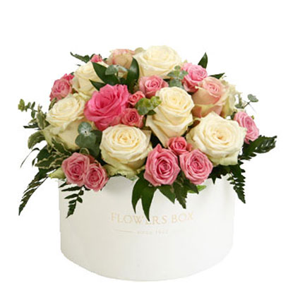 Flower delivery Riga. Arrangement of white roses, pink roses, pink spray roses and white lisianthus in a flower box.