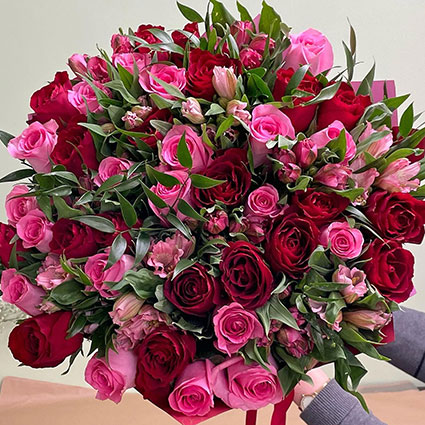 Flower delivery, flower bouquet of red roses, pink roses and pink alstroemeria