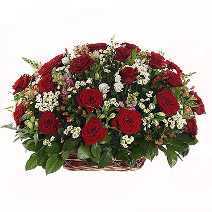 Flowers in Riga. Floral composition in the basket, which will create a blooming meadow senses. Arrangement of red roses,